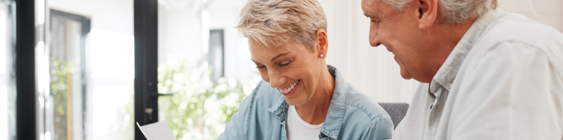 Retirees looking at a paper