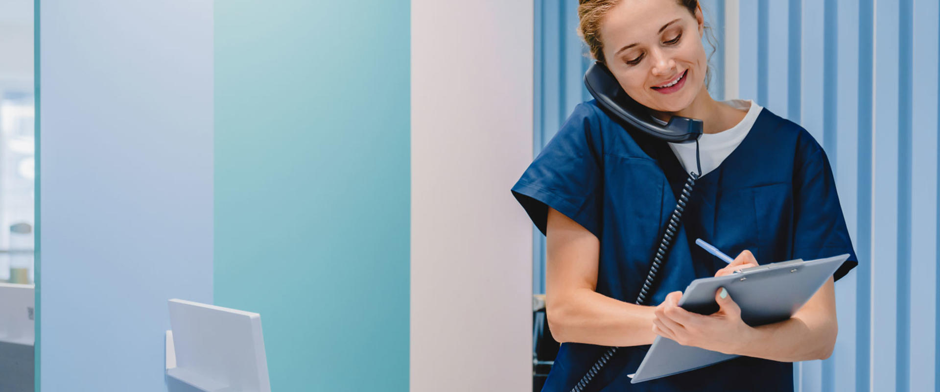 Nurse writing on a chart