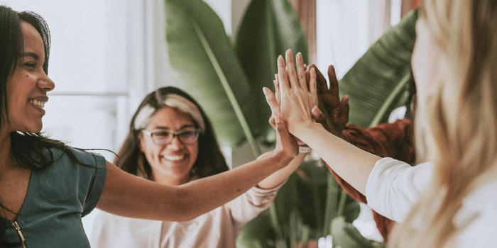 Women High Fiving